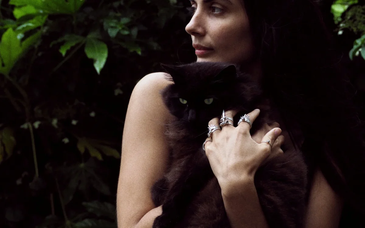 Madge-rings-holding-Roxy-looking-away-SLAB-Jewellery.webp