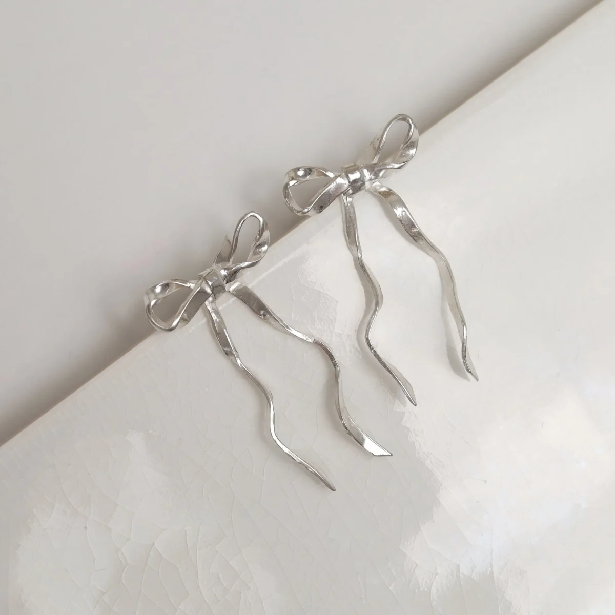 Silver26Steel-EvieSpicer-RibbonEarrings.webp
