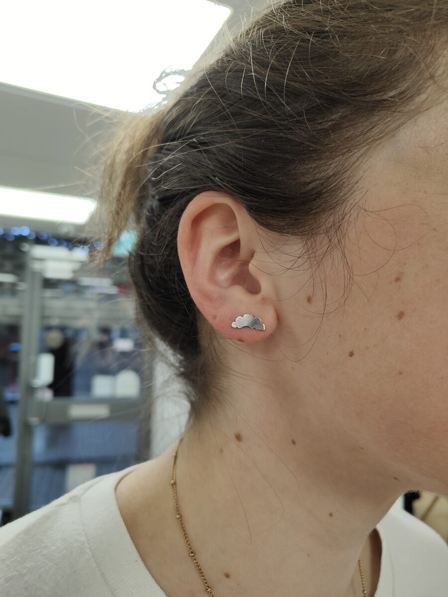 Croissant shaped stud earring handmade in a jewellery studio