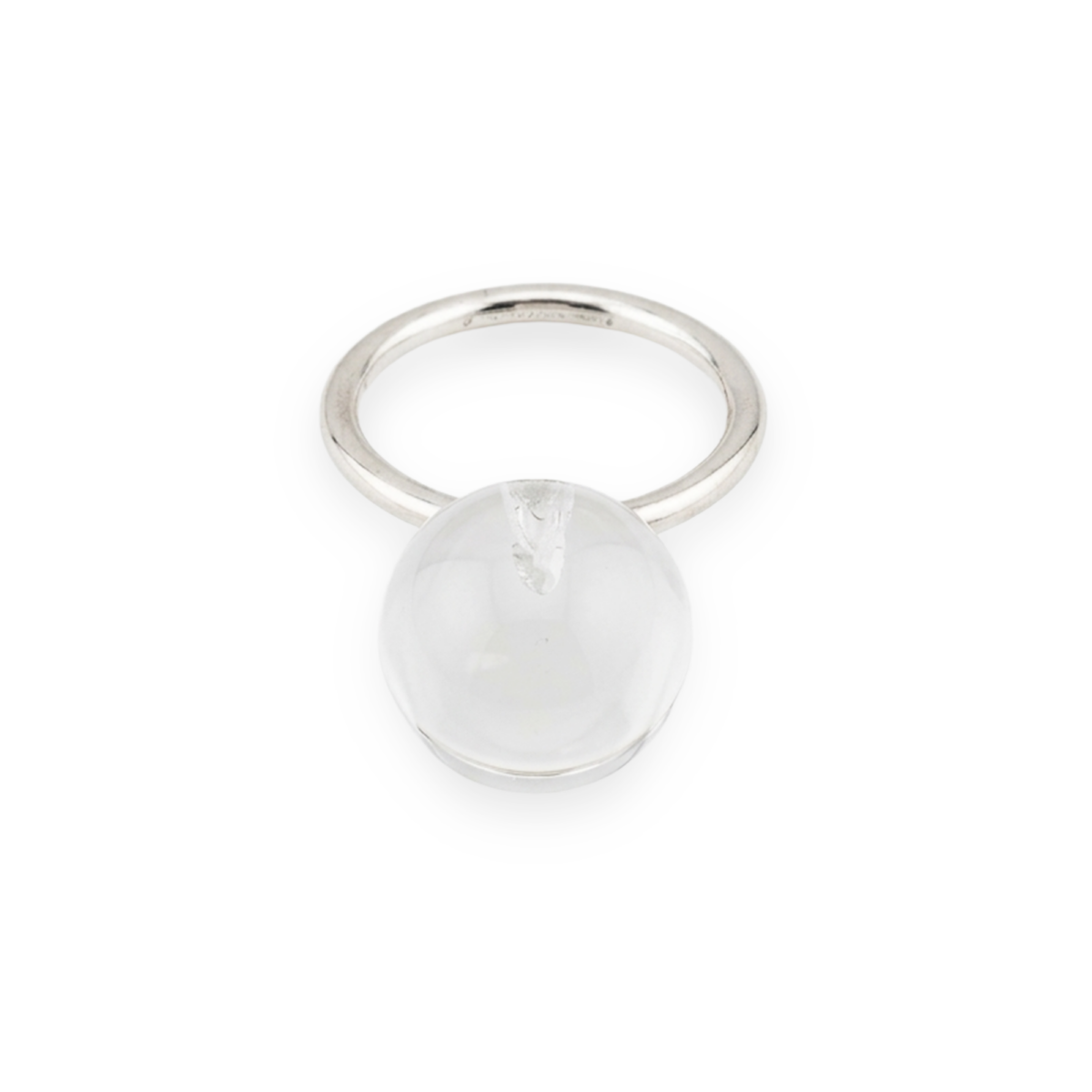a rock crystal sphere is set onto a silver ring